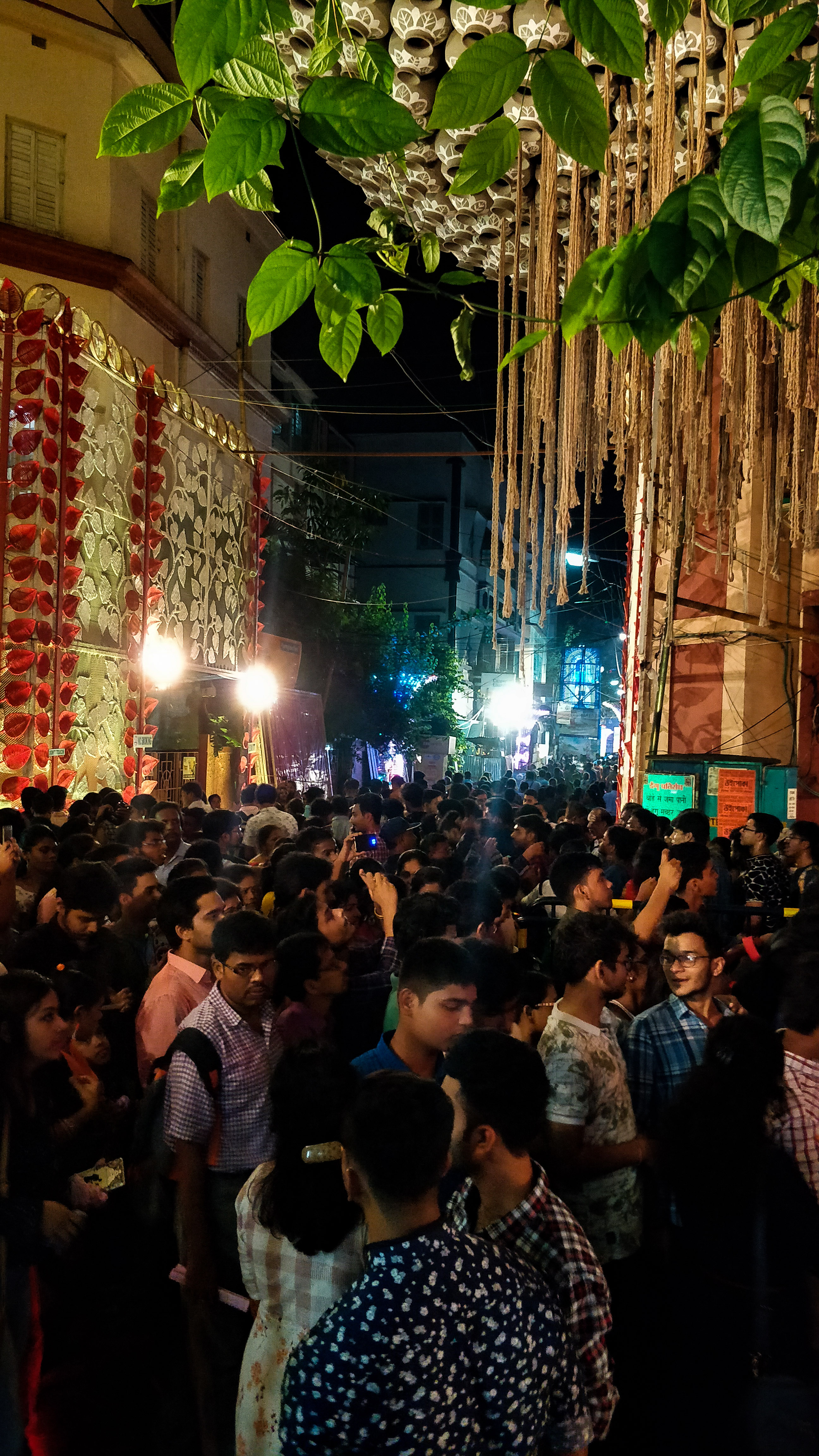 Streets are filled with throngs of people visiting different pandals